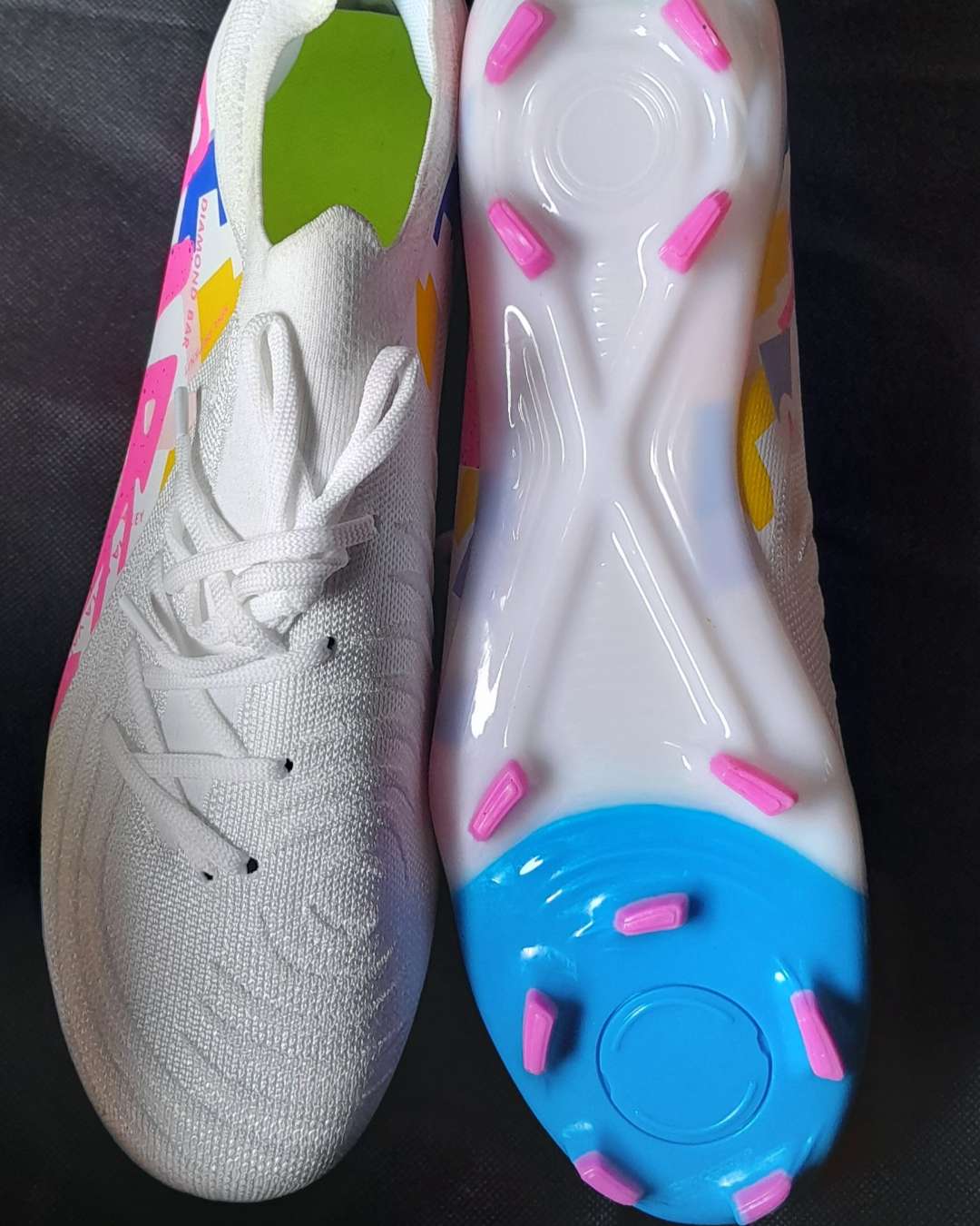 White Football Boots with Pink and Blue Soles