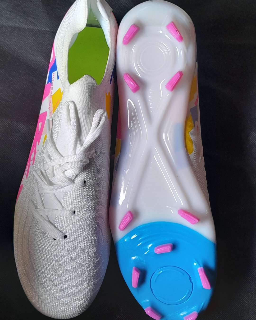 White Football Boots with Pink and Blue Studs